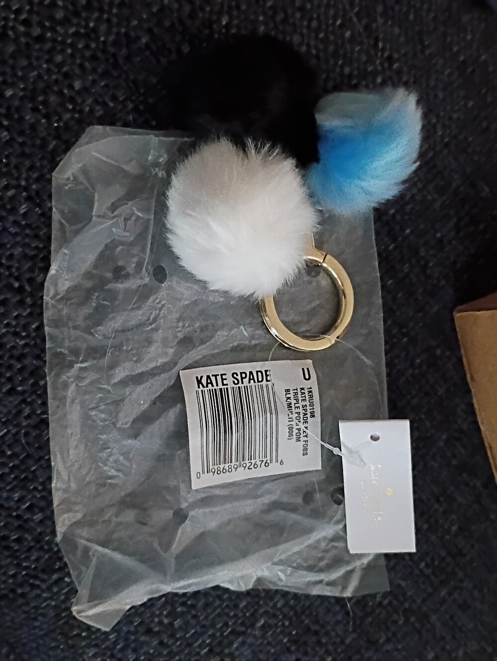 Kate Spade  Pom-Pom Keyring in White, Black & Blue